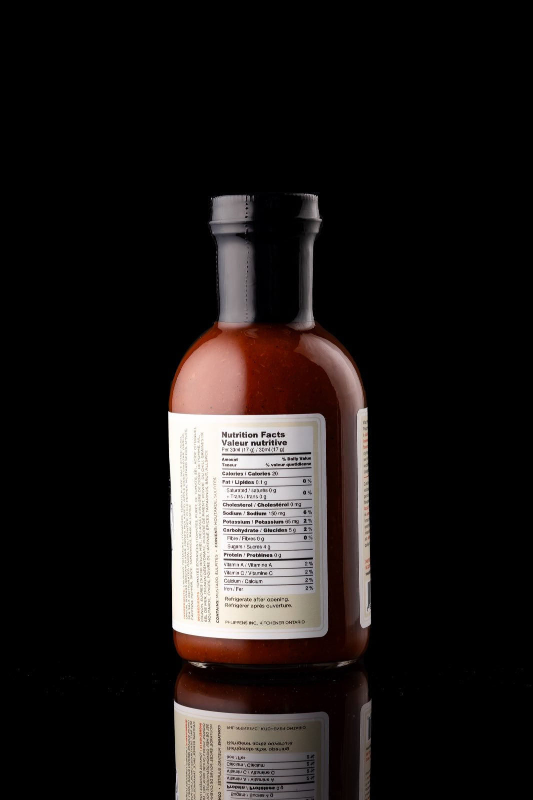 Single back of the bottle of Phlippen Original sauce, made in small batches with hand-smoked local ingredients for a complex flavor, perfect for pizza and meats.