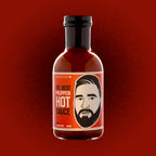 Bottle of Philippen hot sauce with a red label on a red background