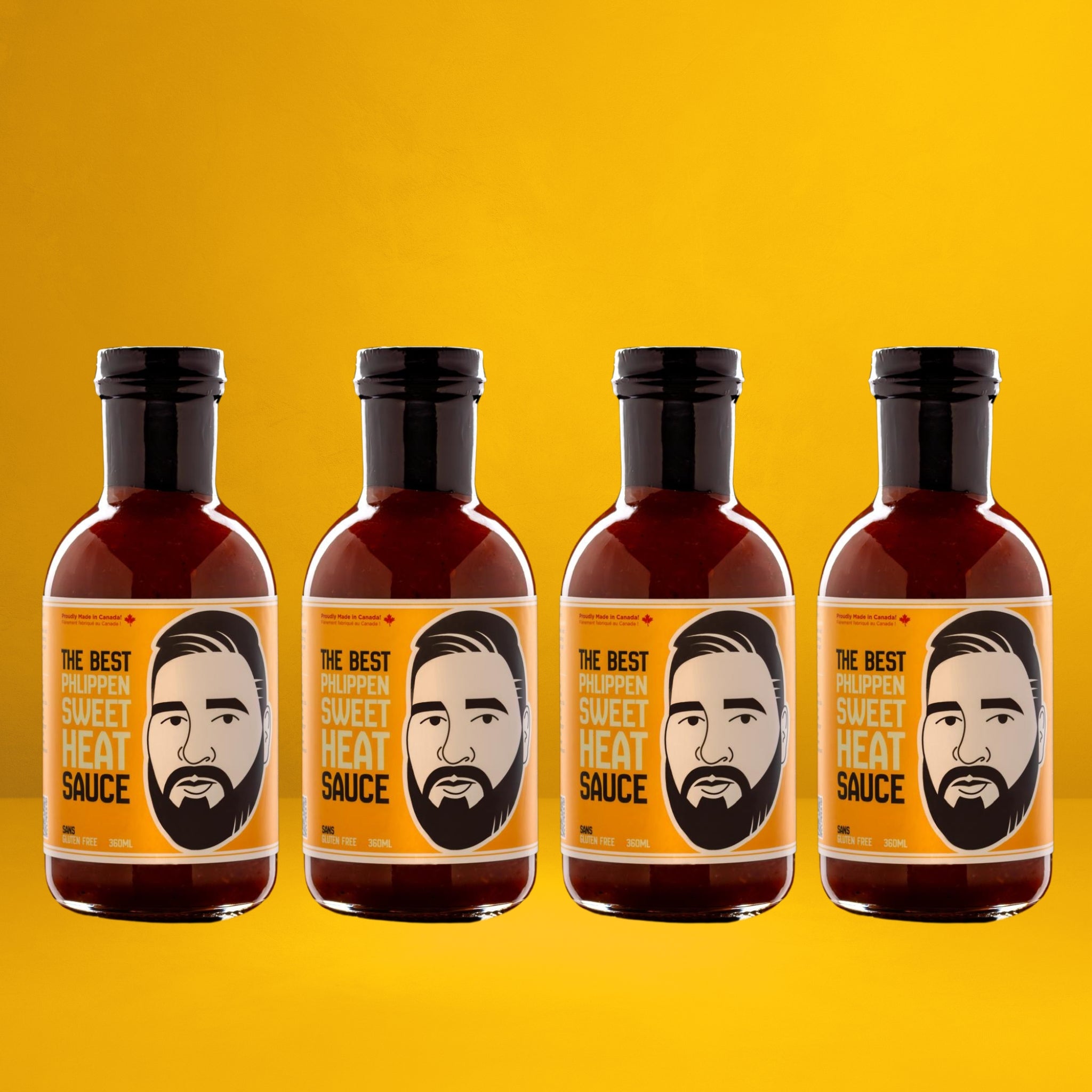 Four bottles of Phlippen's Sweet Heat sauce, the ultimate hot honey alternative, highlighting the small-batch and hand-smoked local ingredients for wings and glazes.